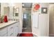 Bright bathroom with a shower, white vanity, and decorative touches at 3407 Melbourne Ln, The Villages, FL 32163