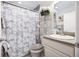 Stylish bathroom featuring a marble shower curtain and modern decorative accents at 3407 Melbourne Ln, The Villages, FL 32163