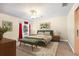 Bedroom with a ceiling fan, neutral walls, and a cozy green bed set at 3407 Melbourne Ln, The Villages, FL 32163