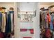 Spacious walk-in closet offers plenty of room to organize clothes, shoes, and personal items at 3407 Melbourne Ln, The Villages, FL 32163