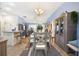 Open concept dining area connects seamlessly with other living spaces creating an inviting and harmonious living experience at 3407 Melbourne Ln, The Villages, FL 32163