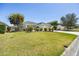 Landscaped front yard and manicured lawn at 3407 Melbourne Ln, The Villages, FL 32163