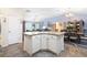 Open concept kitchen island, seamlessly connecting the kitchen with the dining and living areas for an inclusive atmosphere at 3407 Melbourne Ln, The Villages, FL 32163