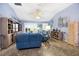Expansive living area with comfortable seating, tile floors, high ceilings, and a seamless flow to other living spaces at 3407 Melbourne Ln, The Villages, FL 32163