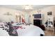 Inviting bedroom with dark furniture, a ceiling fan, neutral walls and ensuite bathroom access at 3407 Melbourne Ln, The Villages, FL 32163
