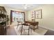 Home office with modern desk, shelving, a neutral color scheme, and natural light at 3407 Melbourne Ln, The Villages, FL 32163