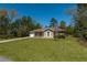 Full view of the house with well kept lawn at 4421 Sw 139 Pl, Ocala, FL 34473