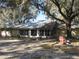 Charming one-story house with large windows, a metal roof, and well-maintained grounds at 4510 Se 183Rd Avenue Rd, Ocklawaha, FL 32179