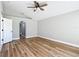 Vaulted ceiling bedroom boasts wood floors and entryway into an arched closet at 4541 Se 30Th St, Ocala, FL 34480