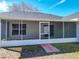 Rear exterior view of home featuring an enclosed screened patio at 4541 Se 30Th St, Ocala, FL 34480