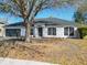 A charming home boasting a well-manicured front yard and inviting facade with ample windows at 4541 Se 30Th St, Ocala, FL 34480