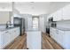 Bright kitchen featuring granite counters, white cabinets and modern appliances at 4541 Se 30Th St, Ocala, FL 34480