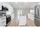 Open concept kitchen with stainless appliances, granite counters and access to the outdoors at 4541 Se 30Th St, Ocala, FL 34480