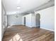 Living room featuring open floor plan, wood flooring, neutral paint and modern fixtures at 4541 Se 30Th St, Ocala, FL 34480