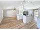 Open concept living room flowing into a kitchen with island and stainless steel appliances at 4541 Se 30Th St, Ocala, FL 34480