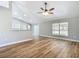 Spacious living room with wood floors, neutral color palette, and sliding glass door at 4541 Se 30Th St, Ocala, FL 34480