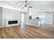Bright living room with wood floors, modern fireplace, and open access to a beautifully updated kitchen at 4541 Se 30Th St, Ocala, FL 34480
