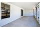 View of the enclosed screened patio showing door and access to yard at 4541 Se 30Th St, Ocala, FL 34480