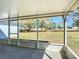 View from enclosed screened patio looking out to the large backyard at 4541 Se 30Th St, Ocala, FL 34480
