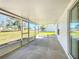 Enclosed screened patio with access to yard and sliding glass door at 4541 Se 30Th St, Ocala, FL 34480