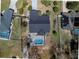 An aerial shot of a home featuring a backyard pool, patio area, and a well-manicured yard at 5037 Sw 109Th Loop, Ocala, FL 34476