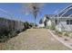 Spacious backyard with mature trees and a screened enclosure providing a serene outdoor retreat at 5037 Sw 109Th Loop, Ocala, FL 34476