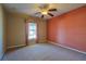 Bedroom with a window and patterned accent wall at 5037 Sw 109Th Loop, Ocala, FL 34476