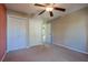 Bedroom with a ceiling fan, carpet, and closet at 5037 Sw 109Th Loop, Ocala, FL 34476
