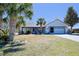 Inviting single-Gathering home with an attached garage, driveway, and lush greenery enhancing curb appeal at 5037 Sw 109Th Loop, Ocala, FL 34476