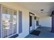 Inviting front porch featuring a calming color scheme, decorative touches and ample natural light at 5037 Sw 109Th Loop, Ocala, FL 34476