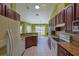 Bright and airy kitchen featuring dark wood cabinetry, granite countertops, and a cozy breakfast nook at 5037 Sw 109Th Loop, Ocala, FL 34476