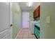 Laundry room with tile flooring, washer and dryer, and overhead cabinets at 5037 Sw 109Th Loop, Ocala, FL 34476