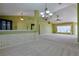 Bright living room featuring high ceilings, clerestory windows, and neutral carpeting at 5037 Sw 109Th Loop, Ocala, FL 34476