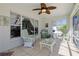 Cozy screened porch with neutral tile and multiple windows to let in the natural light at 5037 Sw 109Th Loop, Ocala, FL 34476