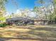 Expansive backyard with a screened-in lanai, ideal for entertaining and relaxing outdoors at 5150 Se 47Th Court Rd, Ocala, FL 34480