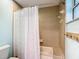Bathroom featuring a bathtub and shower with decorative tile surround and a curved shower curtain rod at 5150 Se 47Th Court Rd, Ocala, FL 34480