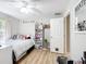 Spacious bedroom featuring wood floors, a toy collection, and natural light at 5150 Se 47Th Court Rd, Ocala, FL 34480