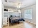 Bedroom featuring a bunk bed, wood floors, and natural light at 5150 Se 47Th Court Rd, Ocala, FL 34480