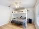 Bedroom featuring a bunk bed, wood floors, and natural light at 5150 Se 47Th Court Rd, Ocala, FL 34480