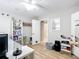 Bedroom featuring wood floors, a toy collection, and natural light at 5150 Se 47Th Court Rd, Ocala, FL 34480