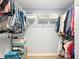 Walk-in closet featuring ample storage with hanging racks, shelving, and organized storage containers at 5150 Se 47Th Court Rd, Ocala, FL 34480