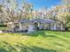Charming single-Gathering home with lush lawn and mature landscaping at 5150 Se 47Th Court Rd, Ocala, FL 34480