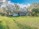 Charming single-Gathering home with lush lawn and mature landscaping at 5150 Se 47Th Court Rd, Ocala, FL 34480