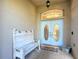 Charming front porch featuring a decorative bench and stylish double doors, creating a welcoming entrance at 5150 Se 47Th Court Rd, Ocala, FL 34480