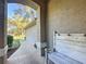 Inviting front porch with brick pavers and bench at 5150 Se 47Th Court Rd, Ocala, FL 34480