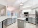 Modern kitchen with stainless steel appliances, island, and ample counter space at 5150 Se 47Th Court Rd, Ocala, FL 34480