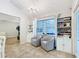 Sitting area with chairs and built in bookcases for reading or relaxing at 5150 Se 47Th Court Rd, Ocala, FL 34480