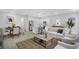 Inviting living area featuring an open layout, neutral color palette, and wood-look tile flooring at 5270 Nw 33Rd Pl, Ocala, FL 34482