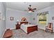 Bedroom with wooden furniture and a ceiling fan at 5560 Ne 31St Ter, Ocala, FL 34479