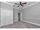 Bedroom with ceiling fan and closet space at 5560 Ne 31St Ter, Ocala, FL 34479